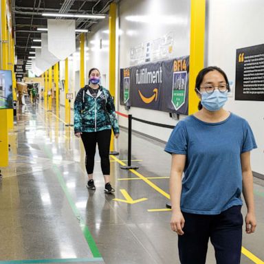 Workers keeping social distance and walking